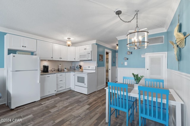 kitchen featuring white cabinets, pendant lighting, ornamental molding, and white appliances