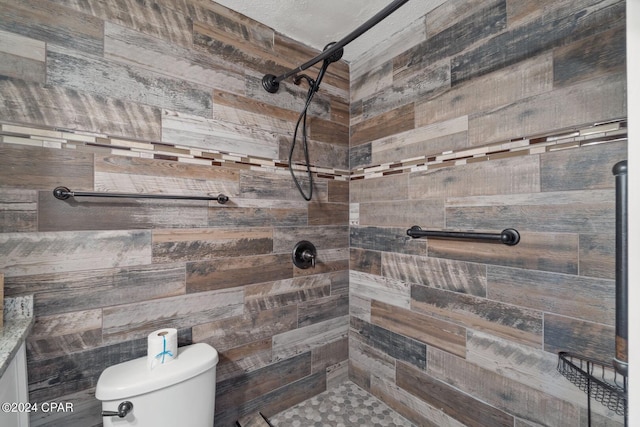 bathroom with wood walls, a shower, and toilet