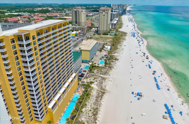 drone / aerial view with a beach view and a water view