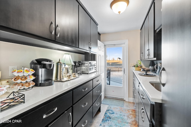 kitchen featuring light tile patterned flooring and sink