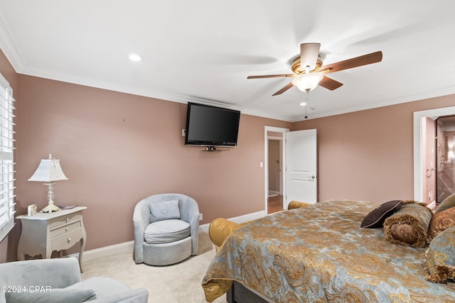 carpeted bedroom with ceiling fan, ornamental molding, and multiple windows