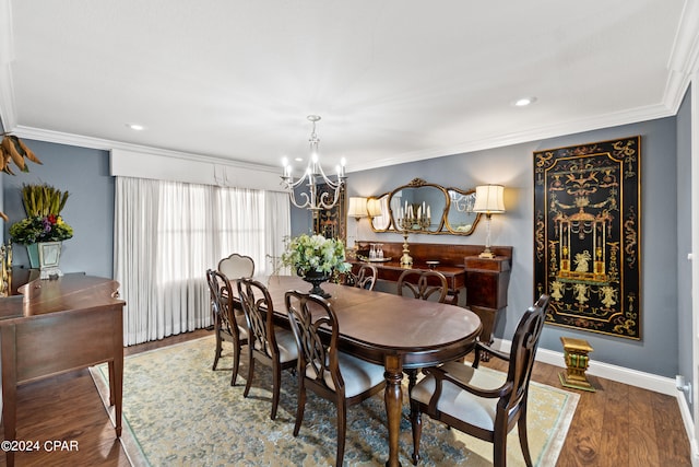 dining room featuring an inviting chandelier, hardwood / wood-style flooring, and crown molding