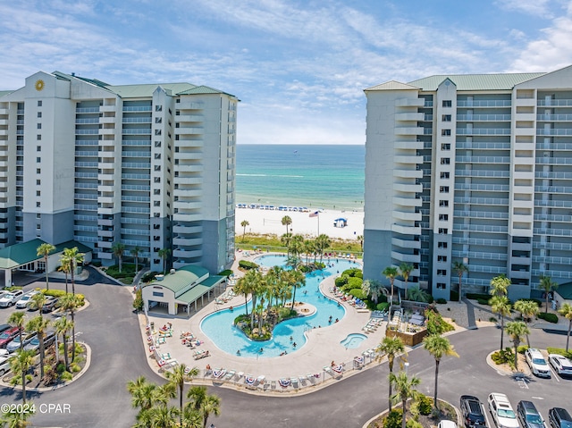 exterior space featuring a view of the beach and a water view