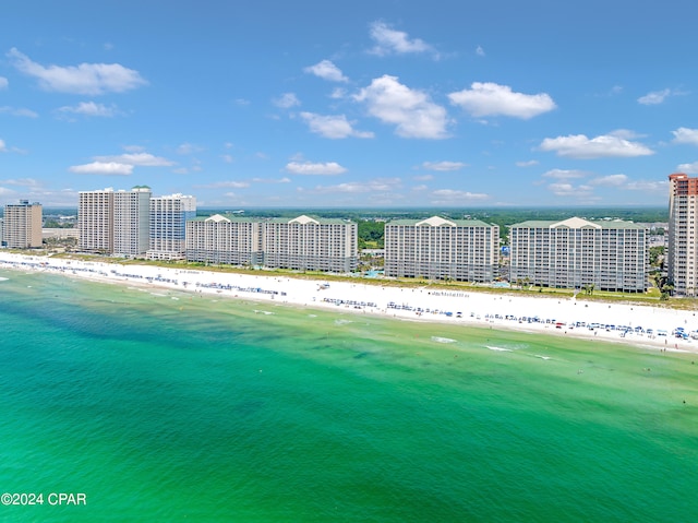 aerial view featuring a view of the beach and a water view