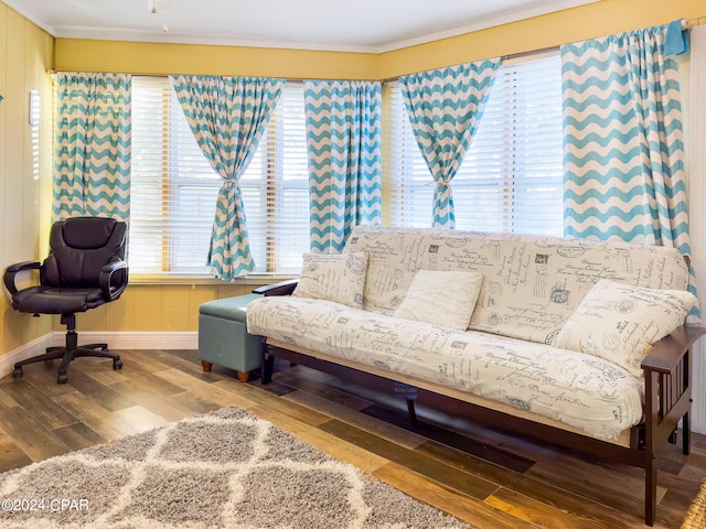 living room featuring crown molding and hardwood / wood-style flooring