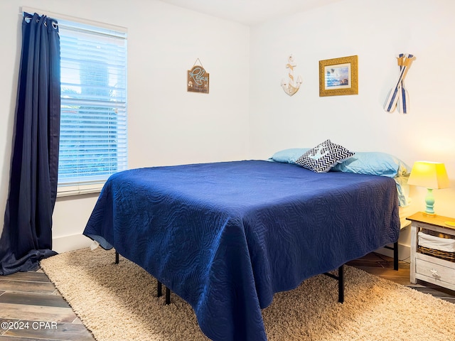 bedroom featuring wood-type flooring