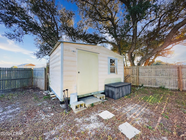 view of shed featuring a fenced backyard