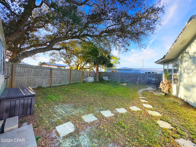 view of yard with a fenced backyard