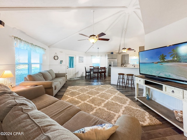 living room with ceiling fan, dark hardwood / wood-style floors, and vaulted ceiling