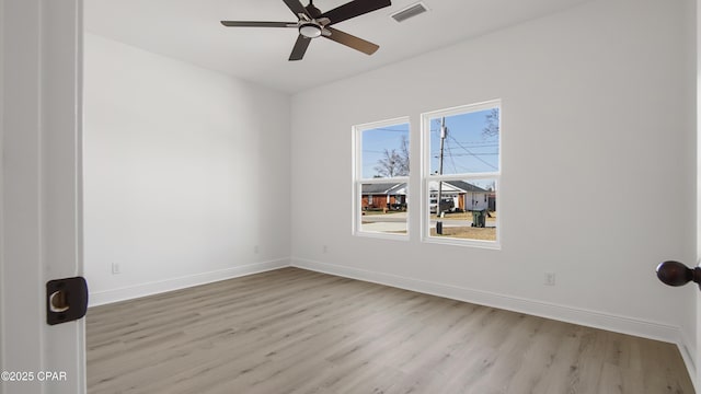 unfurnished room with ceiling fan and light wood-type flooring