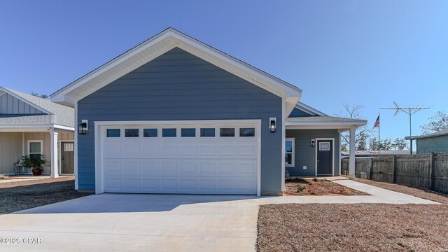 ranch-style home featuring a garage