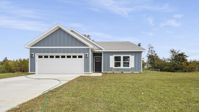 view of front of property featuring a front yard and a garage