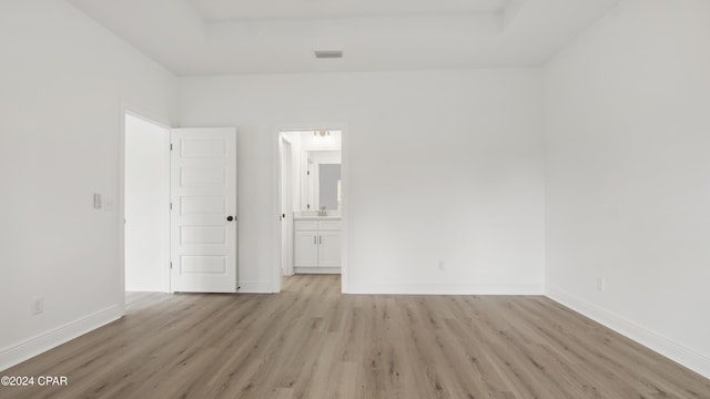 unfurnished room with light wood-type flooring