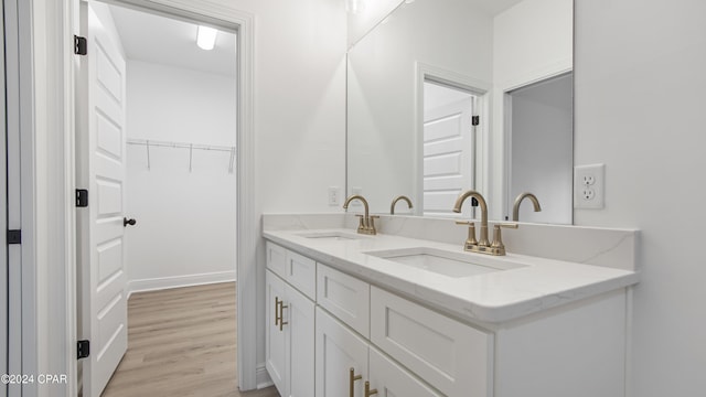 bathroom featuring vanity and hardwood / wood-style flooring