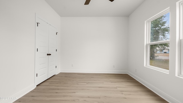 unfurnished room featuring ceiling fan and light wood-type flooring