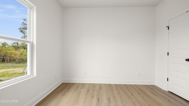 spare room featuring light hardwood / wood-style floors