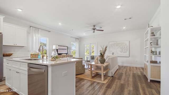 kitchen with stainless steel dishwasher, dark hardwood / wood-style floors, white cabinets, and sink