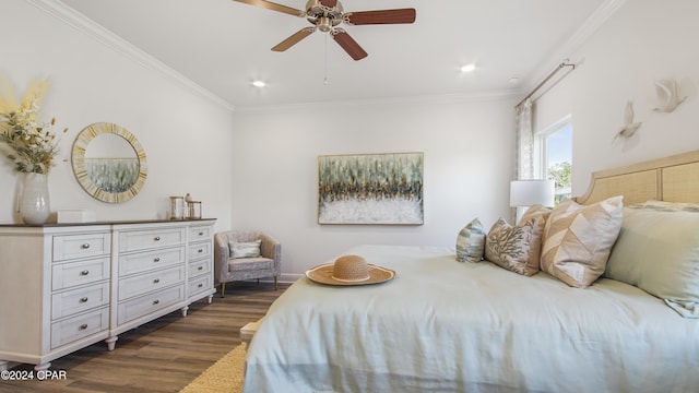 bedroom with dark hardwood / wood-style floors, ceiling fan, and crown molding