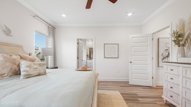 bedroom featuring ensuite bathroom, ceiling fan, light wood-type flooring, and ornamental molding