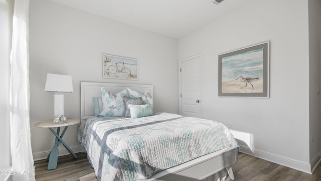 bedroom featuring dark hardwood / wood-style floors