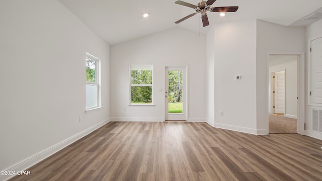 spare room with ceiling fan, wood-type flooring, and high vaulted ceiling