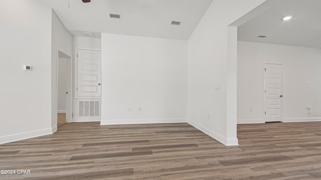 empty room featuring hardwood / wood-style floors and ceiling fan