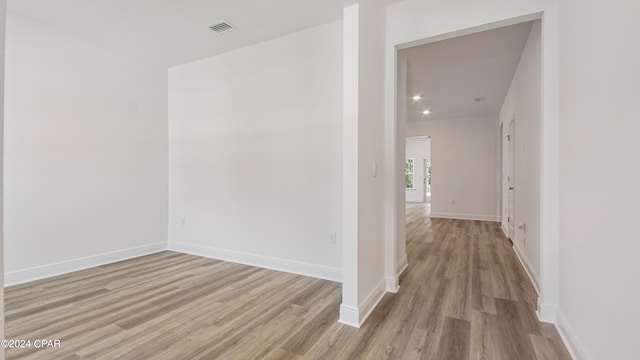 corridor with light hardwood / wood-style flooring