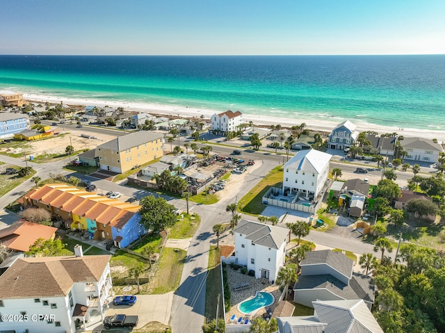 drone / aerial view with a water view and a view of the beach