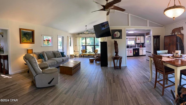 living room featuring dark hardwood / wood-style floors, ceiling fan, and high vaulted ceiling