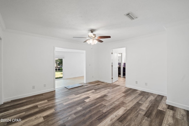 empty room with ceiling fan, dark wood-type flooring, a textured ceiling, and ornamental molding