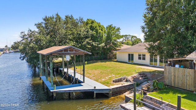 dock area featuring a yard and a water view