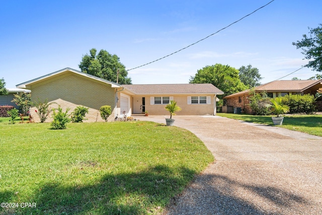 ranch-style home with a front lawn