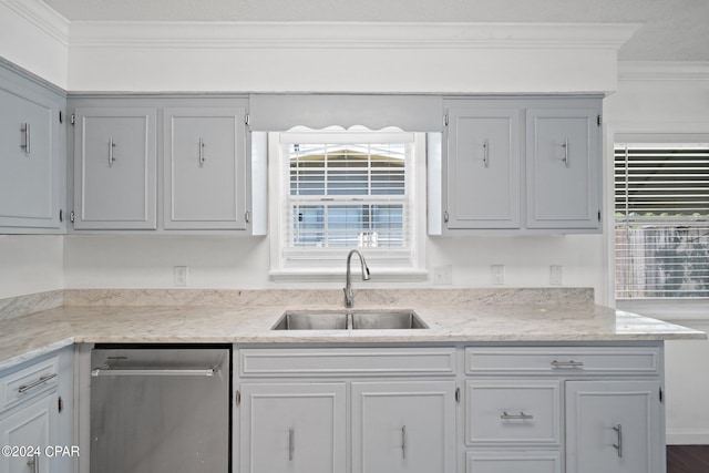 kitchen featuring sink, dishwasher, crown molding, and a healthy amount of sunlight