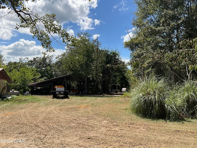 view of yard with a carport