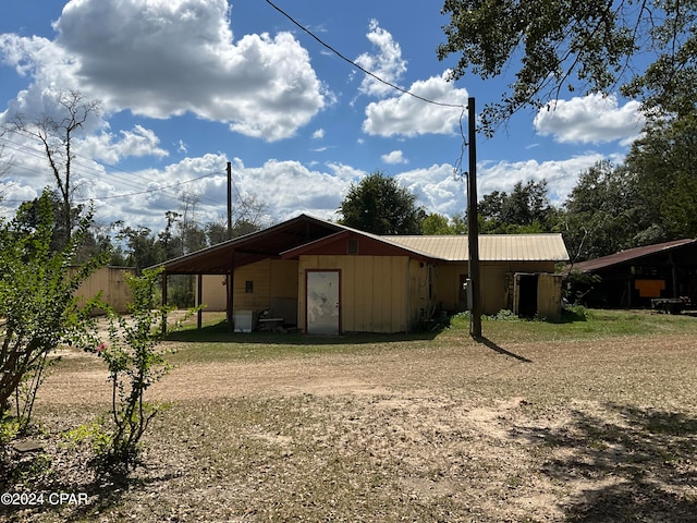 view of side of home featuring a carport