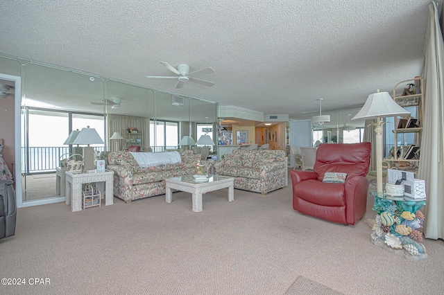 living room with plenty of natural light and carpet floors