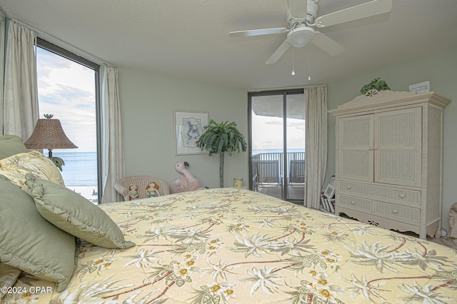 bedroom with ceiling fan and access to outside