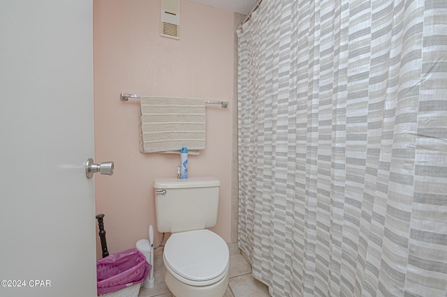 bathroom with tile patterned floors and toilet