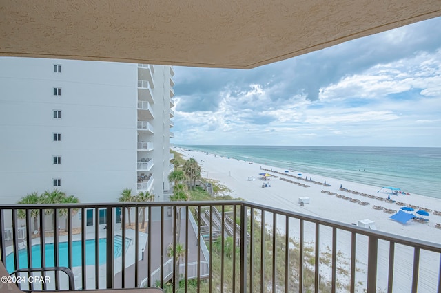 balcony with a view of the beach and a water view