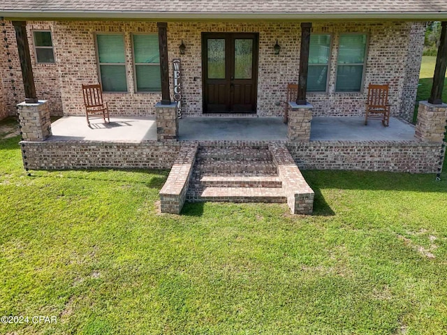 exterior space featuring a lawn and a patio