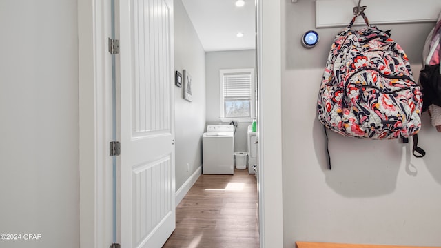 hall featuring washer / clothes dryer and hardwood / wood-style floors