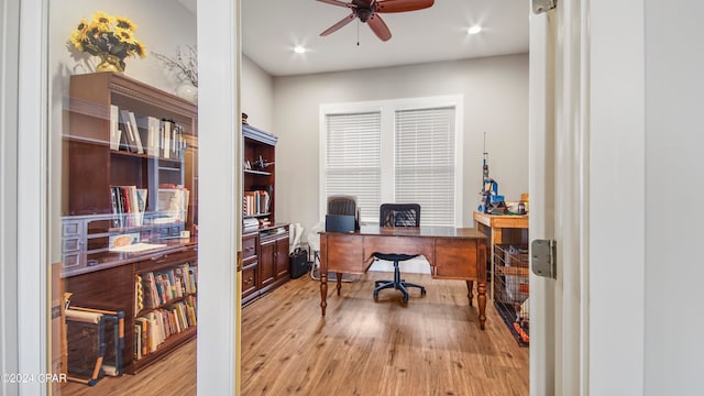 office space with ceiling fan and light hardwood / wood-style flooring