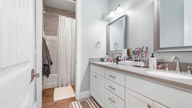 bathroom featuring wood-type flooring, a shower with curtain, and vanity