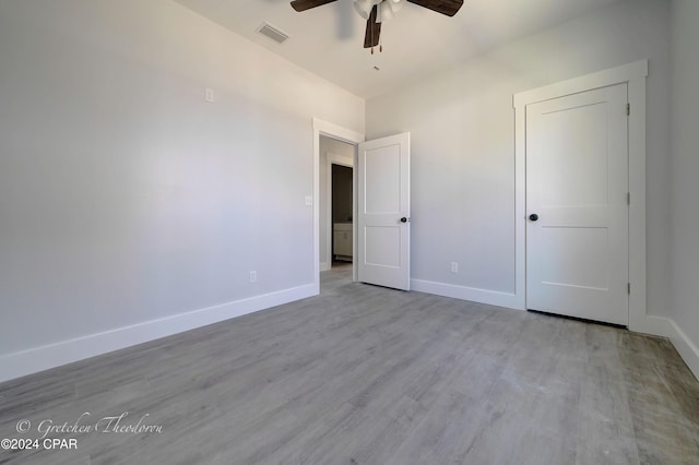 unfurnished bedroom with ceiling fan and light hardwood / wood-style flooring