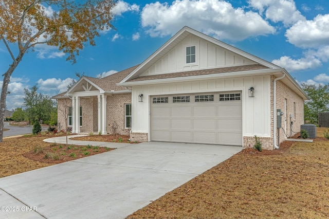 view of front of house featuring a garage and central air condition unit