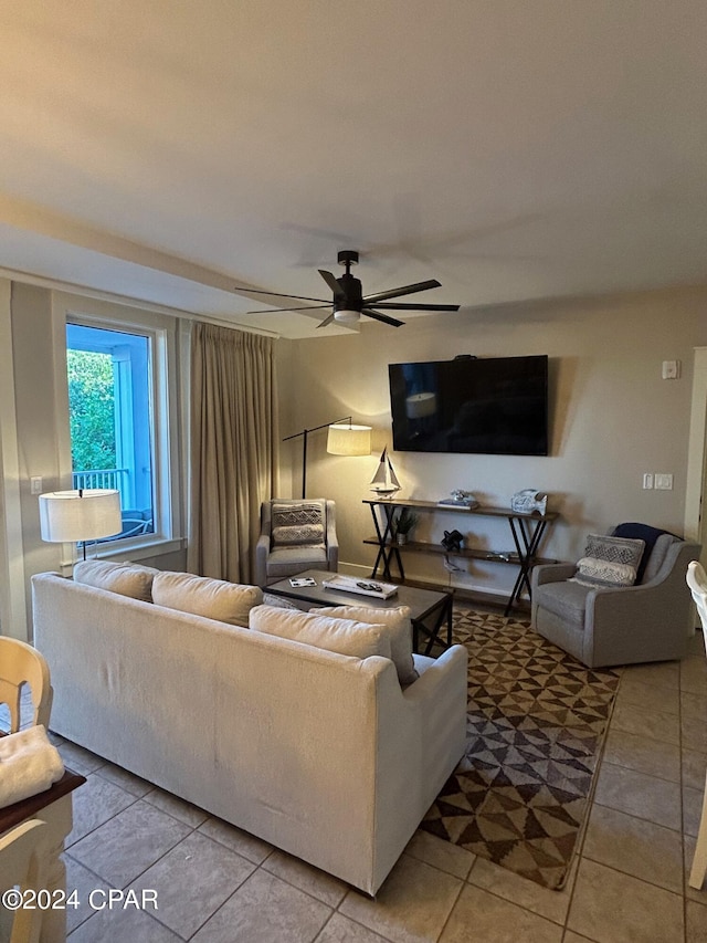 tiled living room featuring ceiling fan