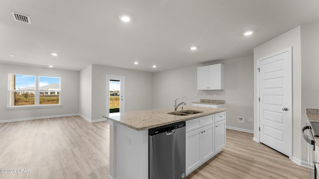 kitchen with sink, light hardwood / wood-style flooring, an island with sink, white cabinets, and appliances with stainless steel finishes