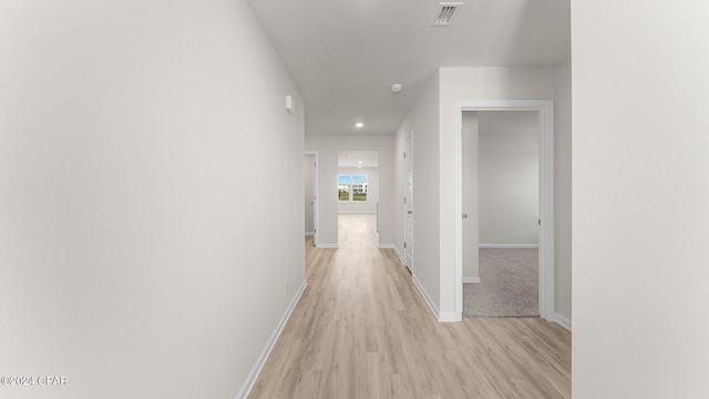 corridor featuring light hardwood / wood-style flooring