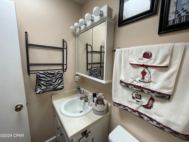 bathroom with toilet and vanity