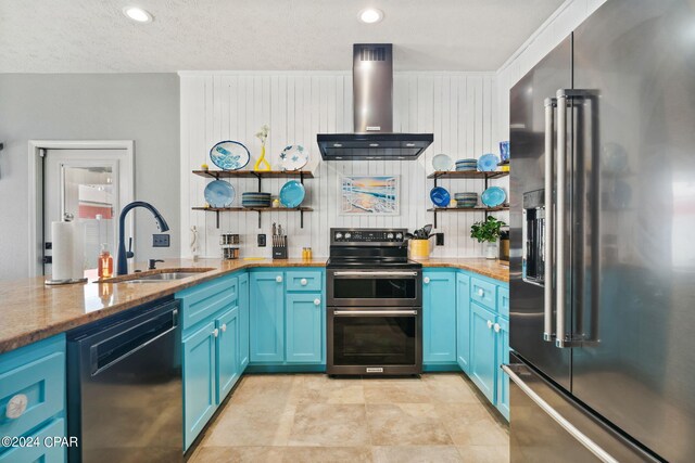 kitchen featuring electric stove and blue cabinets